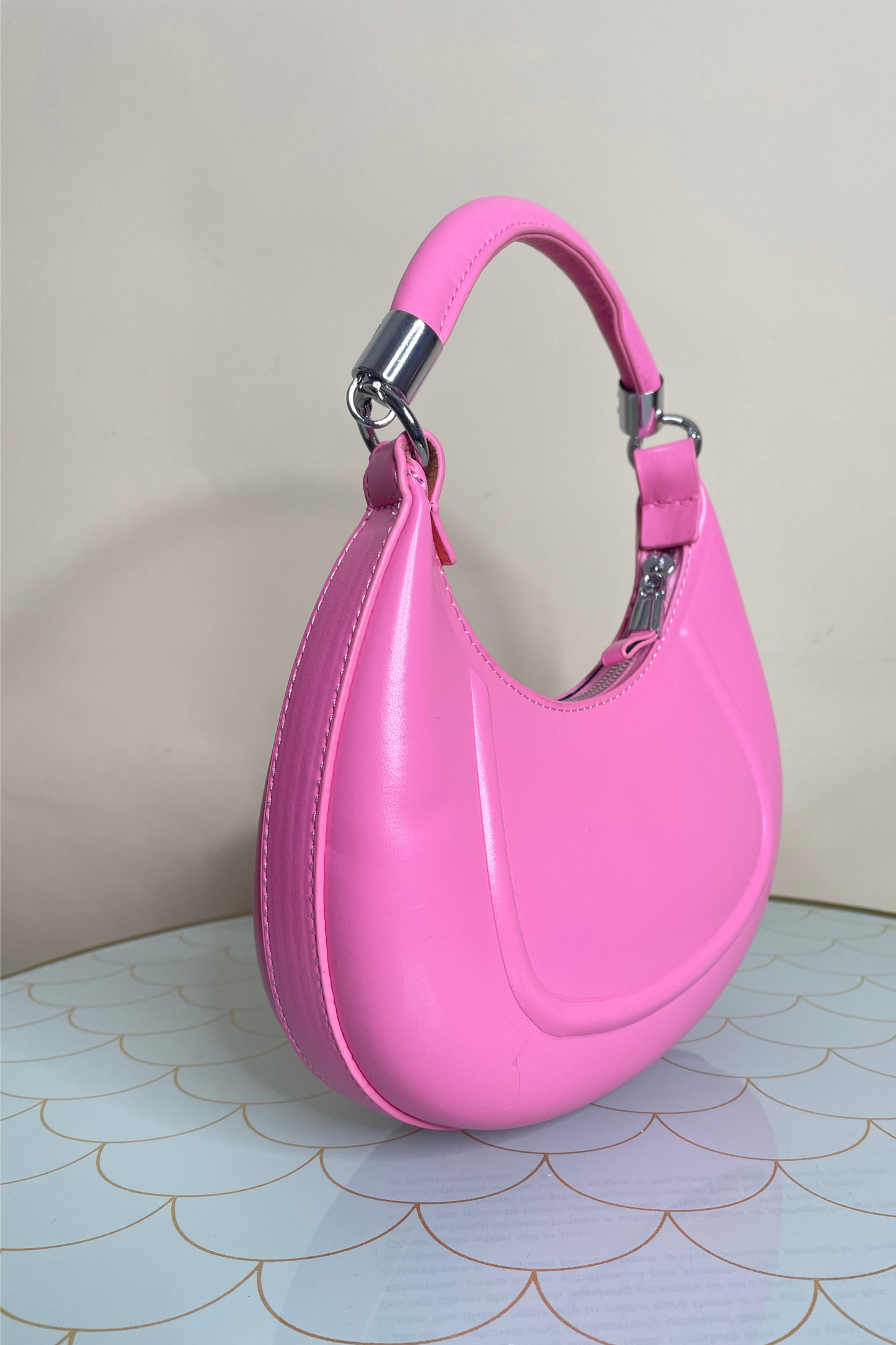 Pink top handle bag with chain