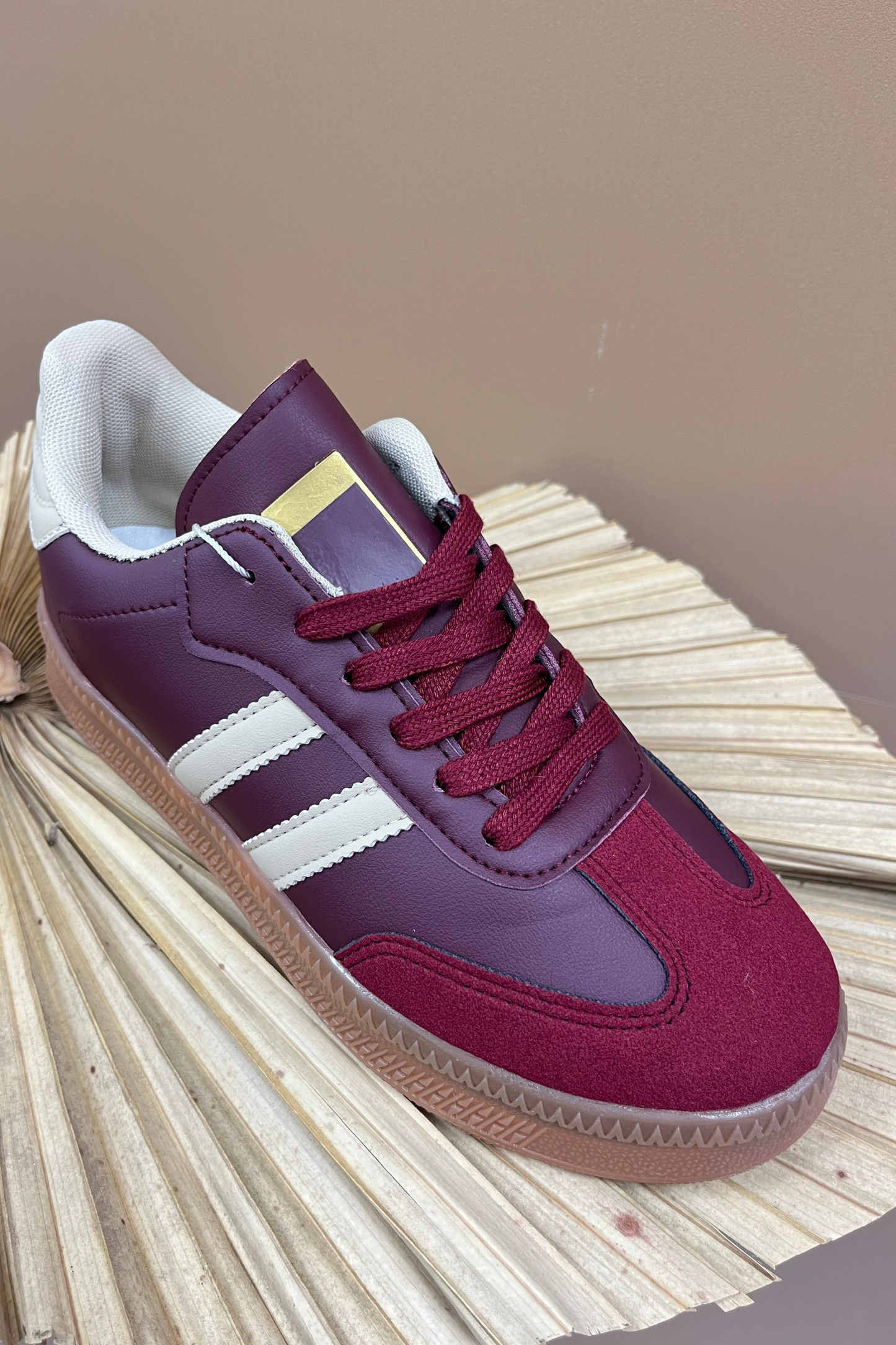 Burgundy lace up trainers