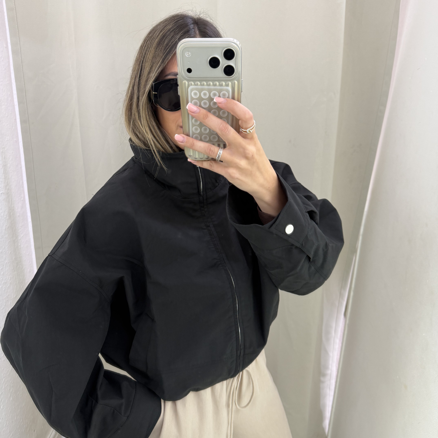 Cropped oversized black windbreaker jacket