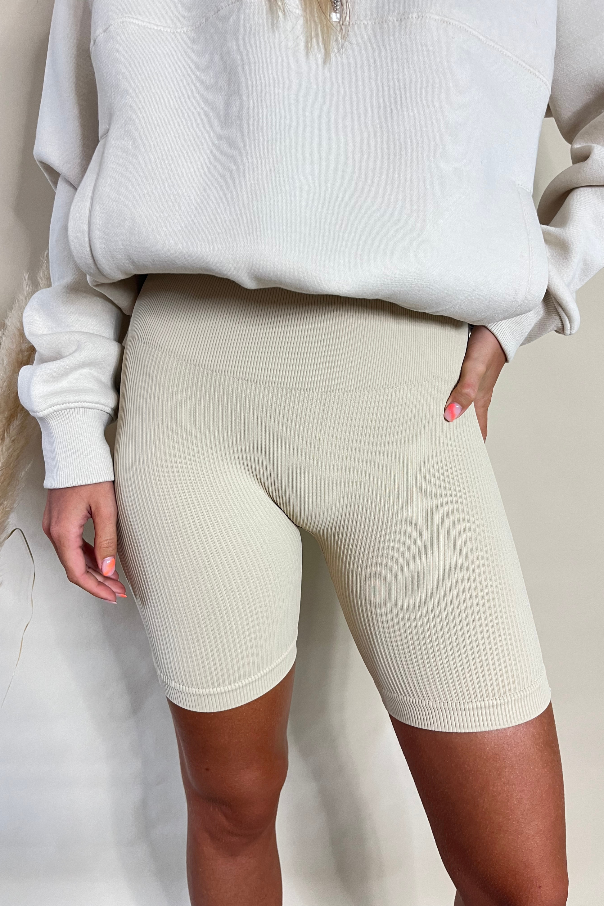 Beige top bicycle shorts