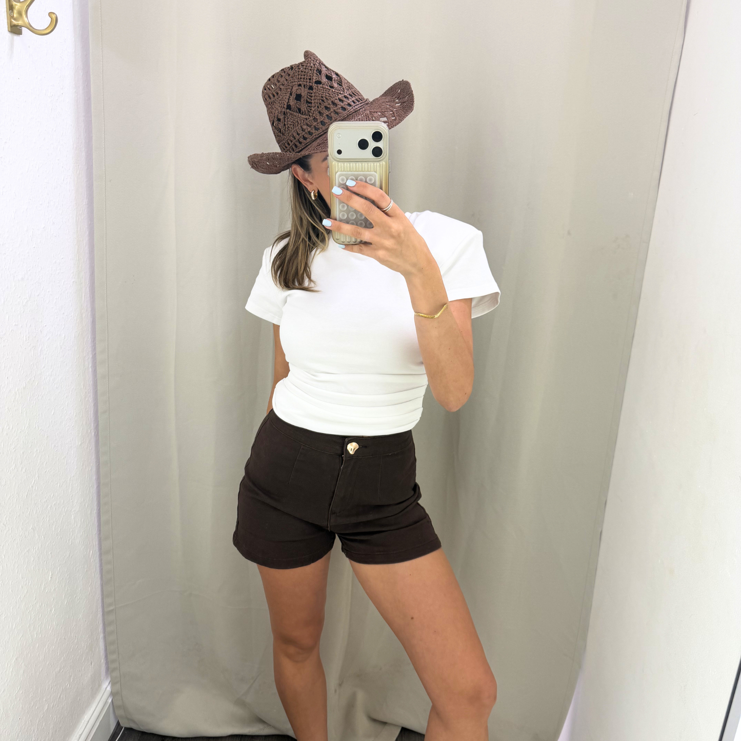 White shoulder padded top