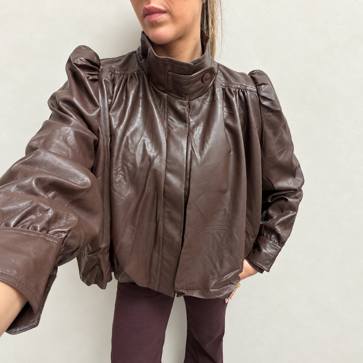 Chocolate brown faux leather high neck jacket, detail view