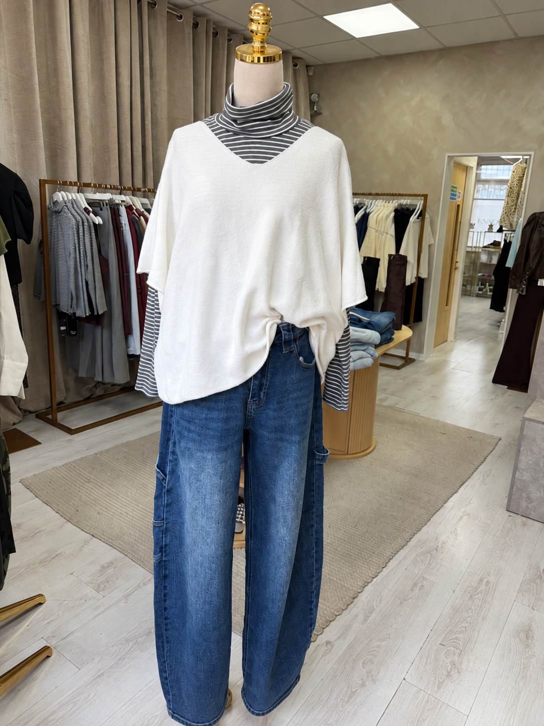 Oatmeal soft knit layered with striped top and jeans